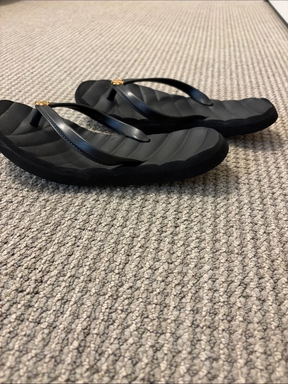 Tory Burch Black Flip Flops with Gold Logo Accent